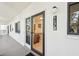 Exterior entryway with a storm door and views inside to unit 1170 at 1170 Bird Bay Way # 206, Venice, FL 34285
