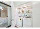 Laundry area with washer and dryer set, showcasing practicality and convenience for everyday living at 1170 Bird Bay Way # 206, Venice, FL 34285