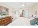 The main bedroom features tile floors, neutral decor, and an en suite bathroom at 1170 Bird Bay Way # 206, Venice, FL 34285