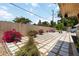 Landscaped backyard with stone tile pavers, flowerbeds, and manicured foliage at 1212 Princeton Ave, Bradenton, FL 34207