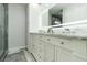 Bathroom features a double vanity with marble countertop, soft-close drawers, and modern LED mirror at 1212 Princeton Ave, Bradenton, FL 34207
