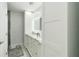 Bright bathroom features double vanity with marble countertop, soft-close drawers, and an LED mirror at 1212 Princeton Ave, Bradenton, FL 34207
