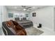This bedroom has a ceiling fan, wall art, and a chair at 1212 Princeton Ave, Bradenton, FL 34207