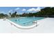Community pool surrounded by a fence and trees, perfect for recreational swimming at 1212 Princeton Ave, Bradenton, FL 34207