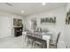 Bright dining room with tile floors, a white table, and nautical decor, offering a cozy atmosphere at 1212 Princeton Ave, Bradenton, FL 34207