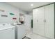 This laundry room has storage cabinets and leads to other rooms at 1212 Princeton Ave, Bradenton, FL 34207