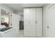 This laundry room has storage cabinets and leads to other rooms at 1212 Princeton Ave, Bradenton, FL 34207