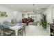 Open living space with dining area and comfortable red leather seating creating a welcoming atmosphere at 1212 Princeton Ave, Bradenton, FL 34207