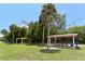 Picturesque park with picnic shelters and palm trees, creating a serene spot for outdoor relaxation at 1212 Princeton Ave, Bradenton, FL 34207