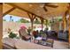 Spacious covered patio with outdoor seating area, ceiling fans, and a tranquil ambiance at 1212 Princeton Ave, Bradenton, FL 34207