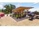 Outdoor patio includes covered seating area, BBQ grill, and stone walkways at 1212 Princeton Ave, Bradenton, FL 34207