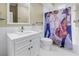 Bathroom with white subway tiles, modern fixtures, and a unique shower curtain at 1221 N Palm Ave # 303, Sarasota, FL 34236