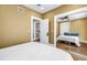 Bedroom featuring a mirrored closet, neutral walls, and hardwood floors at 1221 N Palm Ave # 303, Sarasota, FL 34236