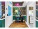 Hallway featuring unique wallpaper that connects to the kitchen and dining room at 1221 N Palm Ave # 303, Sarasota, FL 34236