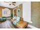 Bright living room with a decorative window, comfortable seating, and charming decor at 1221 N Palm Ave # 303, Sarasota, FL 34236