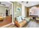 Cozy living room featuring unique architectural details, comfortable seating, and hardwood floors at 1221 N Palm Ave # 303, Sarasota, FL 34236
