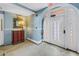 Beautiful lobby with an archway, ornate stained glass door, and antique mirror at 1221 N Palm Ave # 303, Sarasota, FL 34236