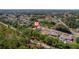 Aerial view of a home nestled among lush greenery in a quiet neighborhood at 12214 Hernando Rd, North Port, FL 34287