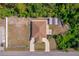 Birds eye view showing the house, yard, and a shed in a wooded lot at 12214 Hernando Rd, North Port, FL 34287