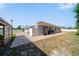 Backyard featuring a paved patio area and outdoor fitness equipment at 12214 Hernando Rd, North Port, FL 34287