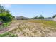 Expansive backyard with ample space for various uses, surrounded by a white fence at 12214 Hernando Rd, North Port, FL 34287