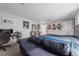 Bedroom featuring a bed, sofa, desk, and sports memorabilia at 12214 Hernando Rd, North Port, FL 34287