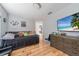 Inviting bedroom with wood floors, a TV, and a comfortable daybed, perfect for a room at 12214 Hernando Rd, North Port, FL 34287