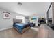 Spacious bedroom featuring a bed, sofa, desk area, and neutral paint at 12214 Hernando Rd, North Port, FL 34287