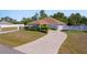 Charming single-story home with a long driveway and well-manicured landscaping at 12214 Hernando Rd, North Port, FL 34287