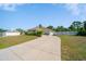 Charming single-story home with a long driveway and well-maintained landscaping at 12214 Hernando Rd, North Port, FL 34287