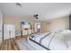 Spacious main bedroom featuring a large TV and wood-look flooring at 12214 Hernando Rd, North Port, FL 34287