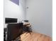Home office area featuring a desk, cabinets, and modern wood floors at 12214 Hernando Rd, North Port, FL 34287