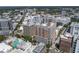 A dynamic aerial view of a city featuring modern architecture, lush trees, and bustling streets at 1350 Main St # 1703, Sarasota, FL 34236