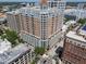 Aerial view showcases condo's architecture, balconies, and prime location within the cityscape at 1350 Main St # 1703, Sarasota, FL 34236