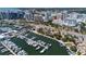 Aerial view of condo complex showcasing marina and waterfront views, and downtown cityscape at 1350 Main St # 1703, Sarasota, FL 34236