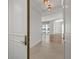 Inviting entryway showcasing light tile flooring and a view into the spacious living area with hardwood floors at 1350 Main St # 1703, Sarasota, FL 34236
