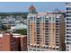 Exterior condo view featuring balconies, a clock tower, and a view of the city skyline and waterfront at 1350 Main St # 1703, Sarasota, FL 34236