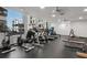 Fitness center features modern equipment, ceiling fans and windows for a refreshing work out experience at 1350 Main St # 1703, Sarasota, FL 34236