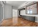 Spacious living area with hardwood floors, contemporary built-ins, and large windows for ample natural light at 1350 Main St # 1703, Sarasota, FL 34236