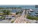 Aerial view showcases a marina filled with boats, surrounded by lush trees and convenient parking at 1350 Main St # 1703, Sarasota, FL 34236