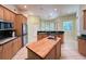 Bright kitchen with center island, stainless steel appliances, light wood cabinets, and plenty of counter space at 13809 18Th E Pl, Bradenton, FL 34212