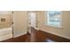 This bedroom has a view from the window and French doors to the hallway and a bathroom at 1420 E Frierson Ave, Tampa, FL 33603