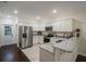 Modern kitchen with stainless steel appliances, shaker cabinets and stone countertops at 1420 E Frierson Ave, Tampa, FL 33603