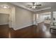 Spacious living room with hardwood floors and view to dining and kitchen at 1420 E Frierson Ave, Tampa, FL 33603