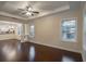 Open-concept living room with hardwood floors, modern trim and molding, and lots of natural light at 1420 E Frierson Ave, Tampa, FL 33603