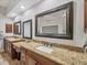 Elegant bathroom with double vanities featuring granite counters and framed mirrors providing a spa-like experience at 15208 21St E Ave, Bradenton, FL 34212