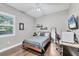 Bedroom with dark wood floors, a ceiling fan, and plenty of natural light at 15208 21St E Ave, Bradenton, FL 34212