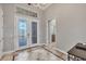 Welcoming foyer features tile flooring and double entry doors with decorative glass at 15208 21St E Ave, Bradenton, FL 34212