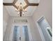 Open foyer featuring elegant double doors, high ceilings, decorative chandelier and natural light at 15208 21St E Ave, Bradenton, FL 34212
