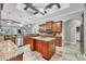 Open-concept kitchen with island, granite counters, stainless appliances, and direct access to the living room at 15208 21St E Ave, Bradenton, FL 34212